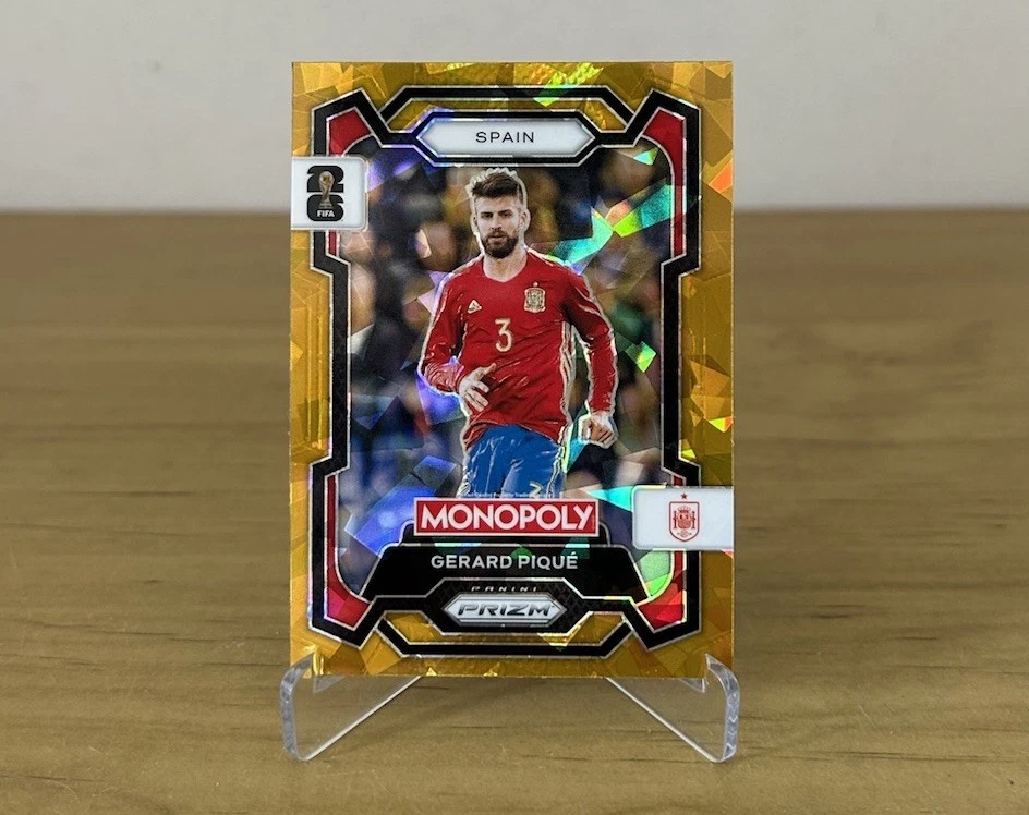 Carta Gerard Piqué Gold Cracked Ice Panini Prizm Monopoly FIFA World Cup 2026